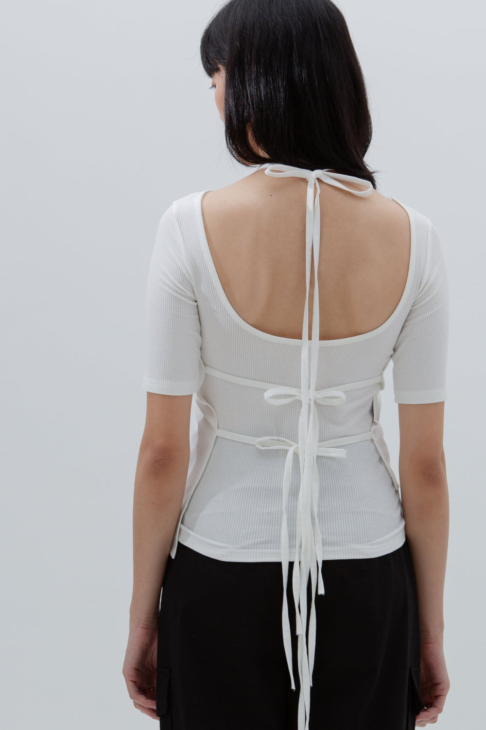 Asymmetrical String Top